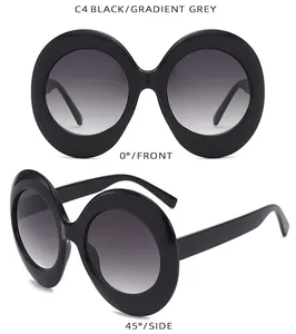 Detail view of oval black sunglasses with gradient grey lenses from front and side angles