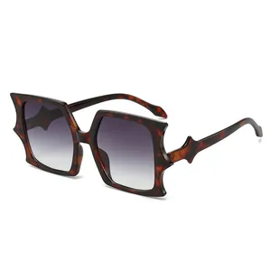 Trendy oversized bat-wing sunglasses with dark tortoiseshell frames and gradient lenses