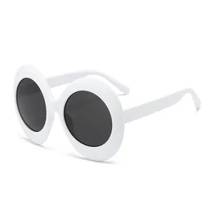 Retro oval thick white frame sunglasses with dark lenses for a trendy street style look