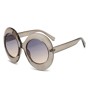 Oval oversized sunglasses with champagne translucent frames and gradient lenses for women