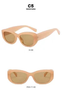 Retro small frame sunglasses in peach pink with textured temples and brown lenses