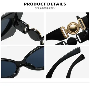 Dettaglio degli occhiali da sole cat-eye nero lucido con decorazioni in metallo dorato