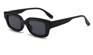 Side view detail of trendy small rectangle black sunglasses with thick frames and grey lenses