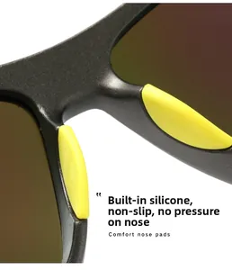 Detailed macro view of soft yellow silicone nose pads on sports sunglasses for anti-slip comfort