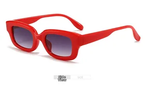 Side view of trendy small-frame red sunglasses with gradient purple lenses for women