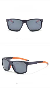 Detail view of purple frame sports sunglasses with orange temples and grey polarized lenses