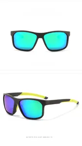 Close-up of matte black sports sunglasses with yellow temples and green polarized lenses
