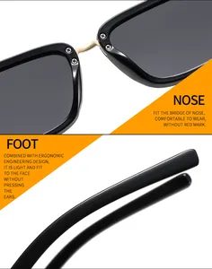 Detailed macro view of ergonomic nose pads and golden metal bridge on black sunglasses