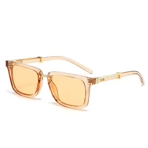 Vintage rectangle sunglasses with transparent amber resin frame and golden metal details