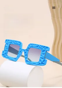 Detail of square sky blue oversized sunglasses with rock texture and purple gradient lens