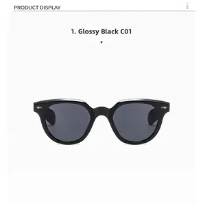 Detail of glossy black square frame sunglasses with metal rivets on the temples