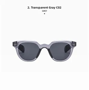Macro detail of transparent grey oval sunglasses with dark lenses and silver rivet studs