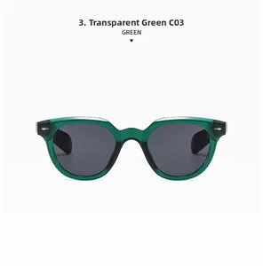 Detailed view of oval transparent green frame sunglasses with silver rivet accents