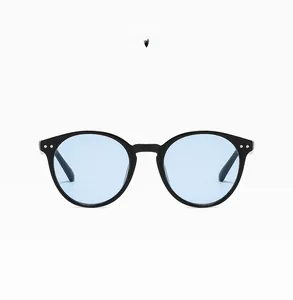 Detail of round black frame sunglasses with blue lenses and silver rivets model C06