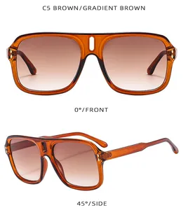 Detail view of brown amber frames with gradient brown lenses and metal hinges