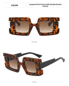 Macro detail of oversized square sunglasses featuring leopard print frames and brown lenses