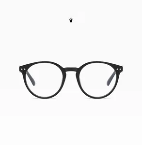 Detail of matte black round frame glasses with anti-blue light clear lenses and metal dots