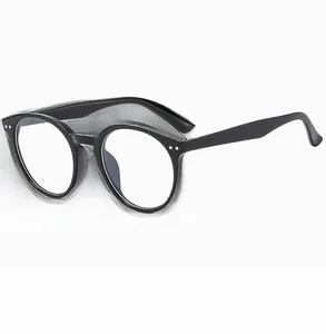 Close-up of retro round black glasses frame with silver rivet details and sleek temples
