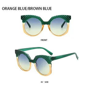 Vues de face et de profil à 45 degrés de lunettes œil de chat vert écaillé et orange