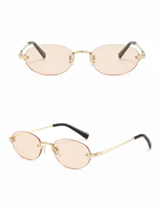 Detail view showing front and side angles of rimless oval sunglasses with gold temples