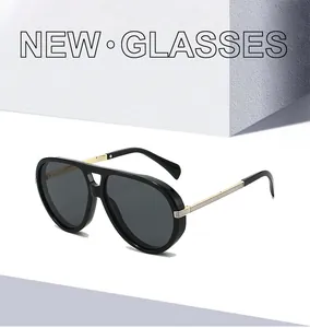 Detail of vintage pilot sunglasses featuring black frames and gold metallic temple accents
