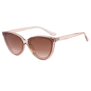 Women's cat-eye sunglasses with translucent tea frames and brown gradient lenses