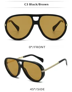 Detail view of black pilot sunglasses with brown lenses and golden metal temple accents