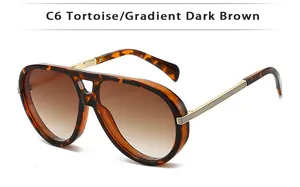 Detail of tortoise frame aviator sunglasses with gold metal temples and gradient brown lenses