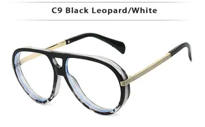 Detail of vintage aviator eyewear frame with black leopard pattern and golden metal arms