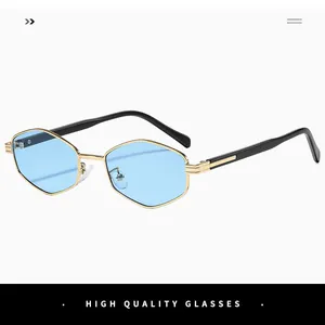 Detail of polygonal gold metal frames with light blue lenses and high quality finish