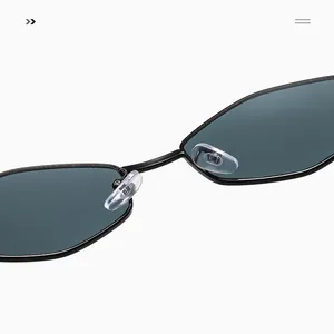 Macro detail of sleek metal bridge and clear silicone nose pads on polygon sunglasses