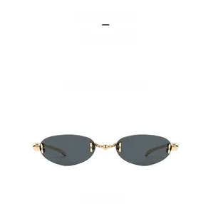 Front view of C1 gold frame rimless oval sunglasses with dark grey lenses for women