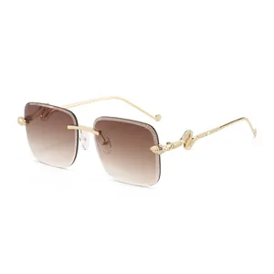 Lunettes de soleil rétro sans monture avec verres dégradés et branches serpent dorées