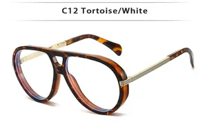 Detail view of double bridge aviator sunglasses with tortoise frame and gold metal temples