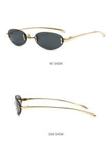 Detail of rimless oval sunglasses with gold metal frame and dark grey lenses