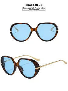 Detail view of tortoiseshell frames with light blue lenses and slim gold metal temples