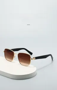 Detail view of square gold metal sunglasses frame with gradient brown lenses on pedestal