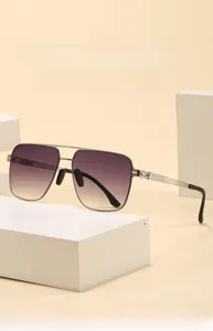 Close-up of square metal aviator sunglasses with gradient lenses and double bridge detail