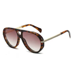 Oversized tortoise shell aviator sunglasses with brown gradient lenses and gold accents