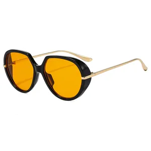 Fashionable large black frame sunglasses with orange lenses and gold metal temples
