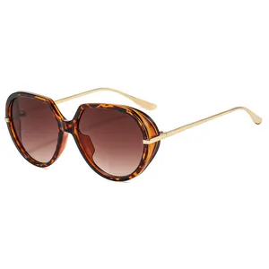 Fashionable oversized tortoise shell sunglasses with gold metal temples and brown lenses