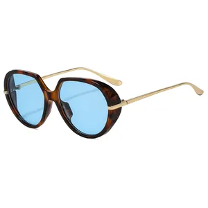 Fashion vintage oversized sunglasses with tortoiseshell frame and light blue lenses