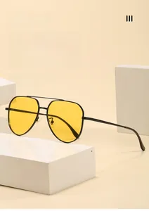 Classic black metal aviator sunglasses with yellow polarized lenses and double bridge detail