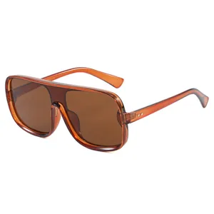 Oversized flat top aviator sunglasses with amber frames and brown tinted lenses