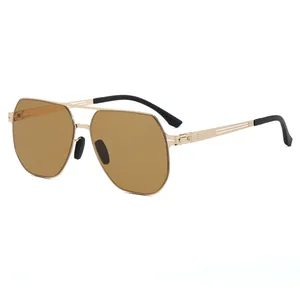 Lunettes de soleil aviateur rétro octogonales avec monture dorée et verres ambrés