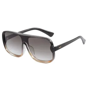 Fashionable oversized one-piece sunglasses with gradient lenses and dark frame