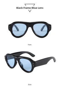 Detailansicht der schwarzen Sonnenbrille mit blauen Gläsern und goldenen Nieten