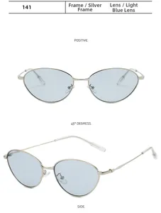 Détail de lunettes de soleil ovales avec monture en métal argenté et verres bleu clair