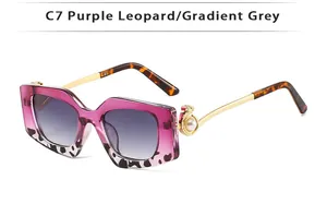 Close-up of pearl accent and leopard head relief on gradient purple square sunglasses