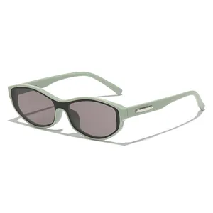 Fashionable mint green oval sunglasses with silver metal trim and dark lenses
